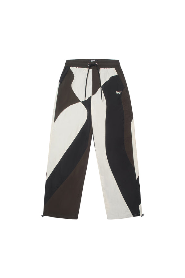 Brown and white BOY London pants with geometric design on a white background