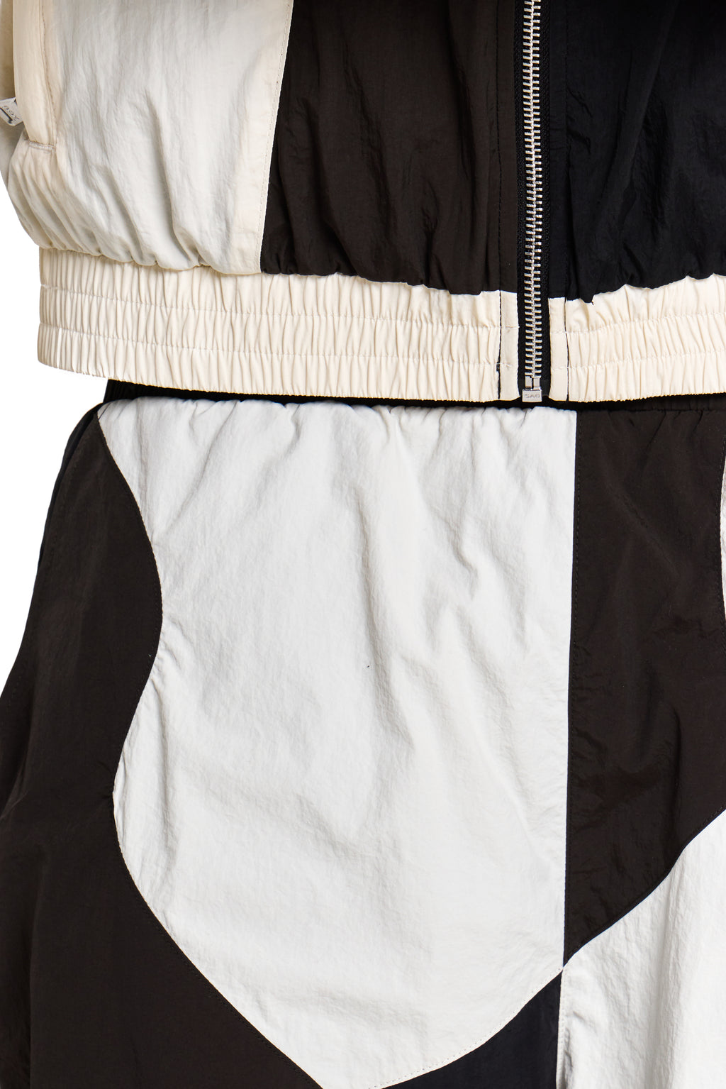 Close-up of a black and white jacket with a zipper