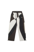 Brown and white BOY London pants with geometric design on a white background