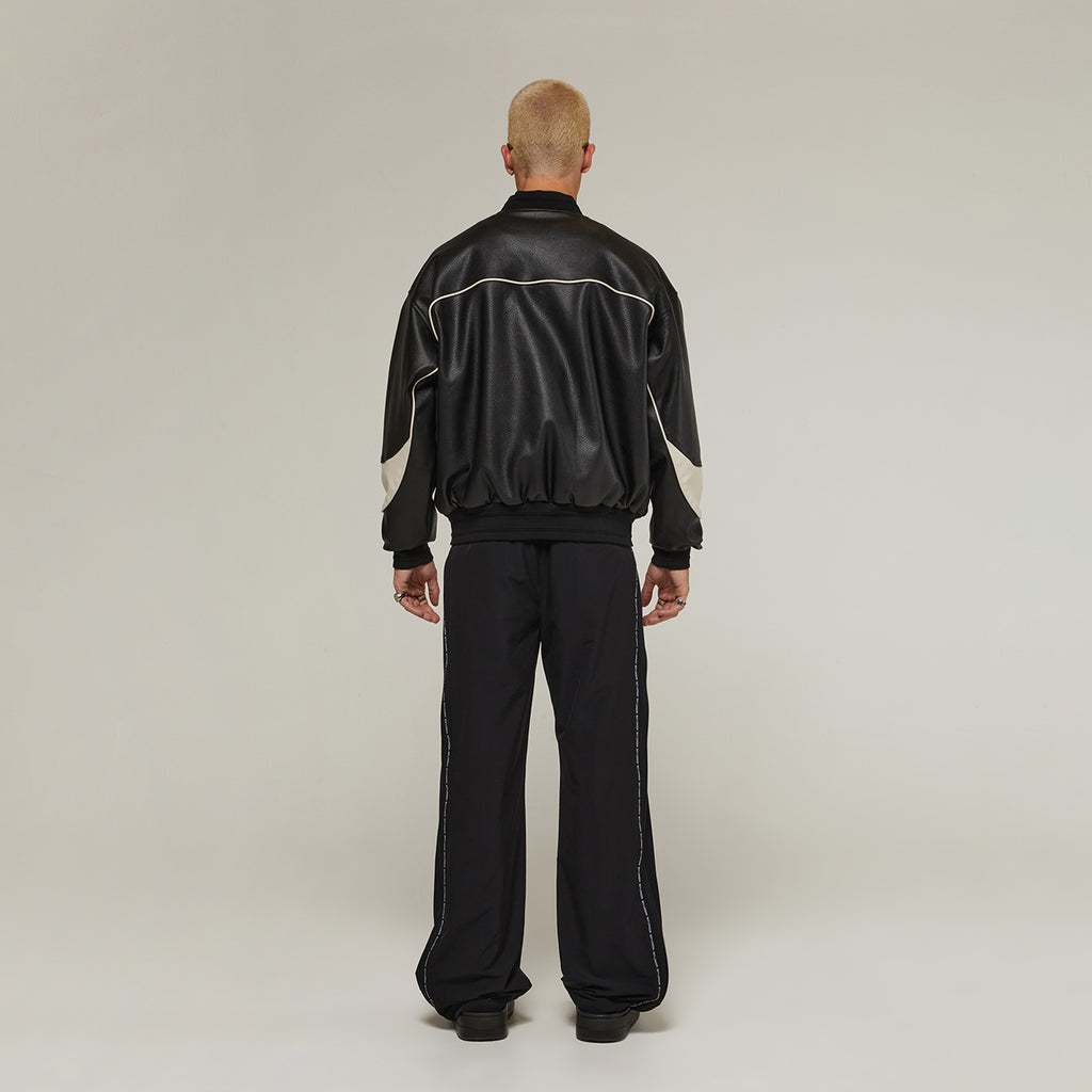 Male model wearing Boy London on white background