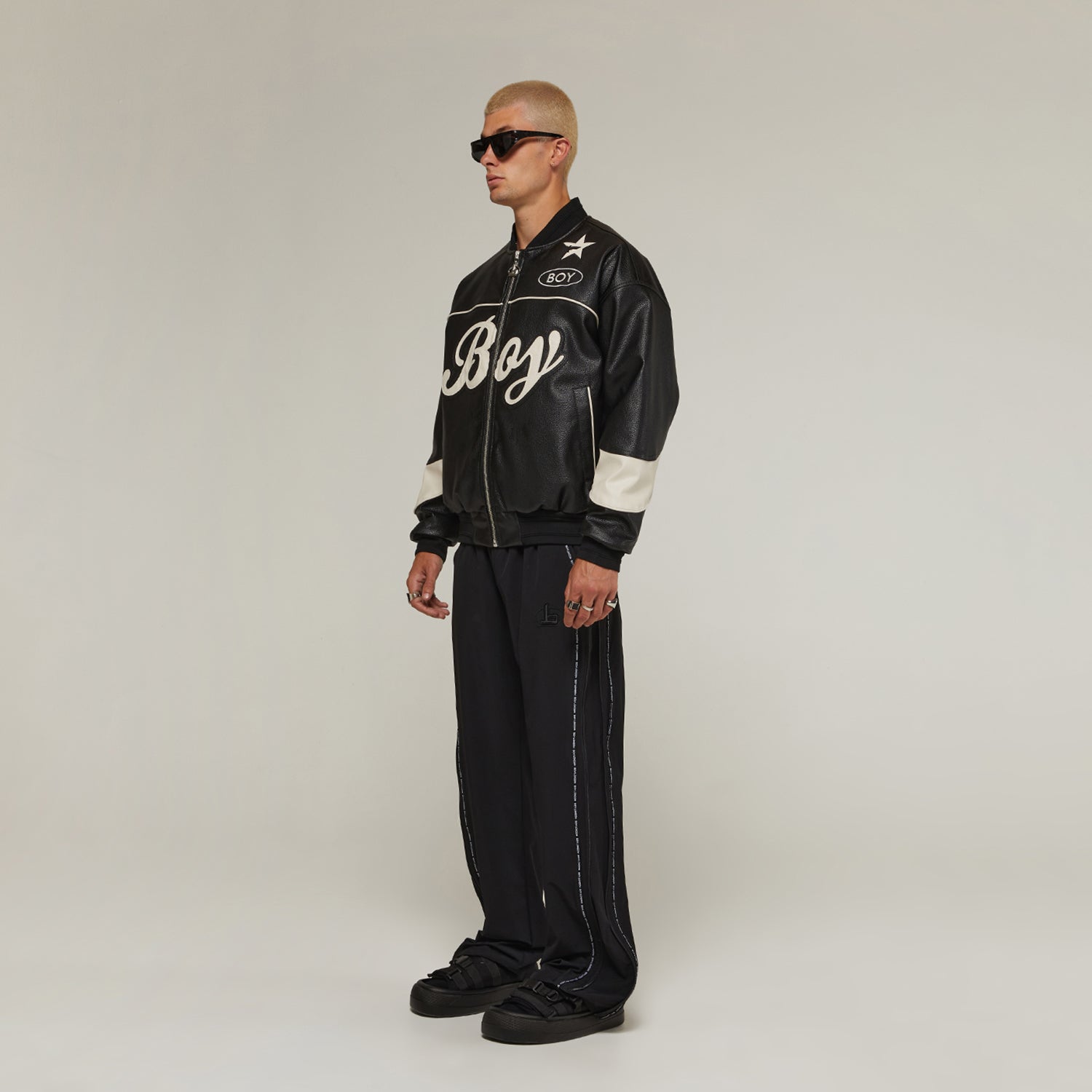 Male model wearing Boy London on white background