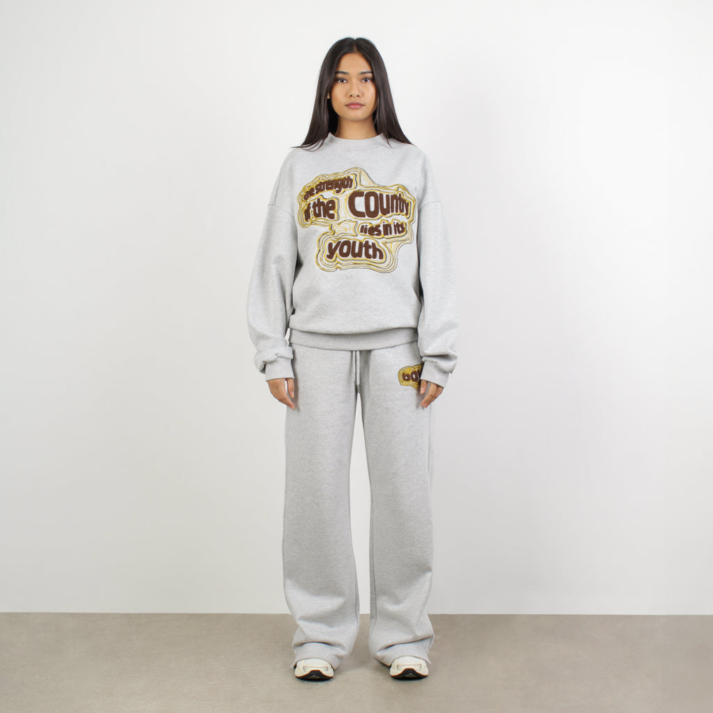 Female model wearing BOY London on white background 