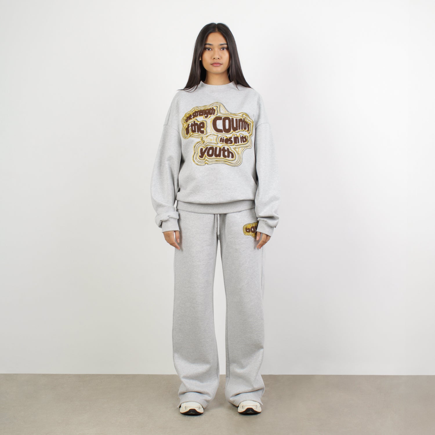 Female model wearing STRENGTH SWEATSHIRT-SWEATSHIRTS-BOY London