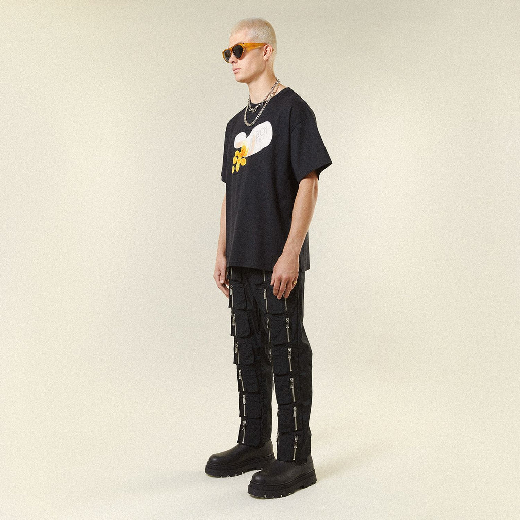 Male model wearing BOY London shirt on plain background