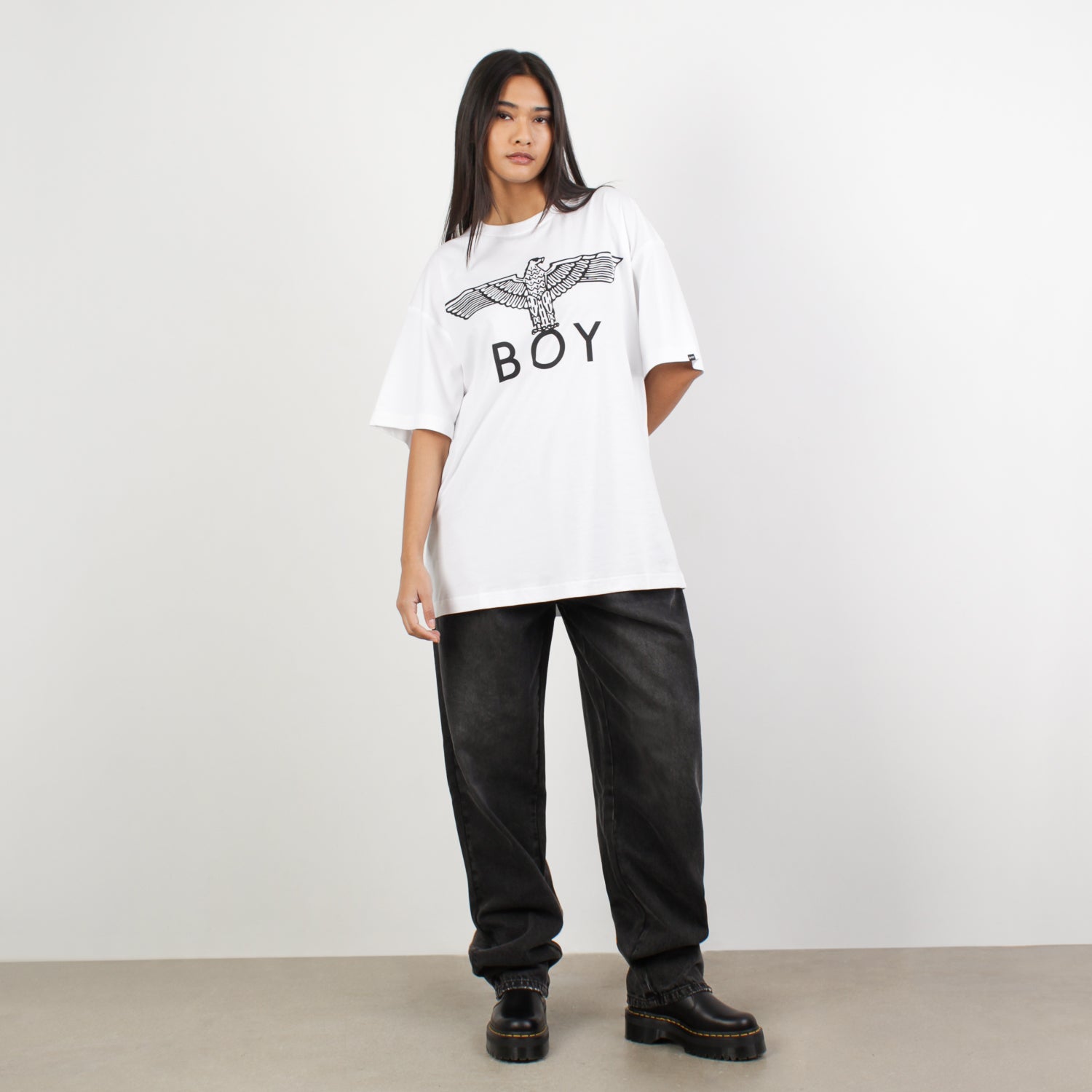 Female model wearing BOY London on white background