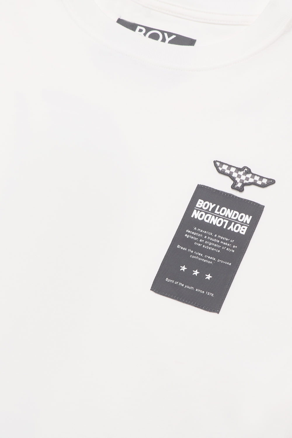 Close-up of a label with 'BOY LONDON' text on a white background