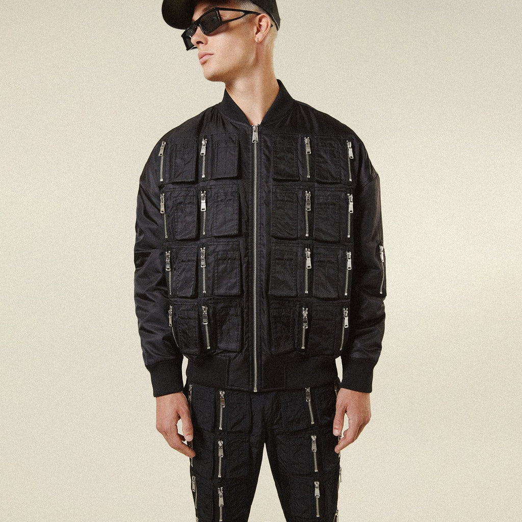 Model wearing BOY London jacket on plain background 