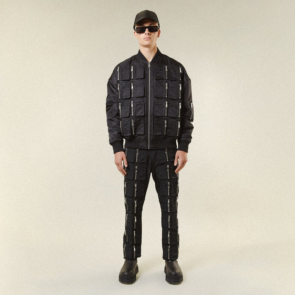 Model wearing BOY London jacket on plain background 