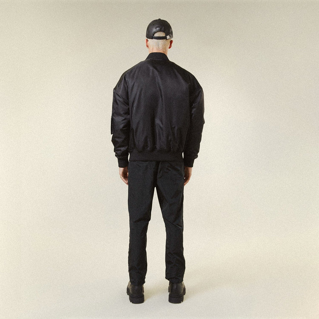 Model wearing BOY London jacket on plain background 